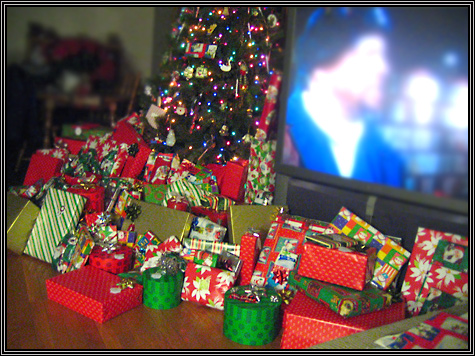 Brittni's mom was in the hospital for Christmas ... so while the cat's away the mice watched football on the bigg screen tv and actuallly played football and ate and opened a LOT of gifts ... 