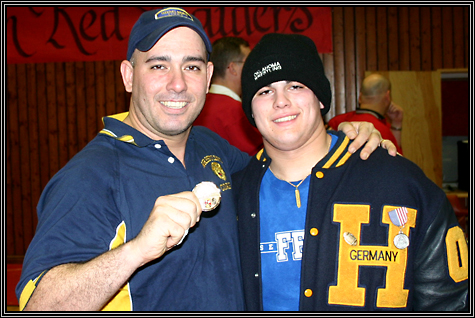 Darrin, his son and the gold foil wrapped chocolate coin ... wrestling in Germany ... February 3, 2007 ... unknown photographer ...    