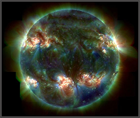 This is the SUN! Unpredictable magnetic fields occur, causing sunspots and bright active regions. This image from TRACE is a 3 wavelength ultraviolet representation of that activity. Most of the sun appears dark because only active regions emit a significant amount of this UV light. I just LOVE this picture! Photo by Stanford-Lockheed NASA ... 